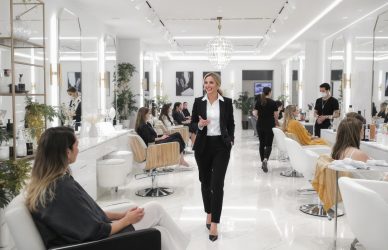 Salon manager guiding staff and coordinating client services — ideal for showcasing nearby leadership roles in the beauty industry.