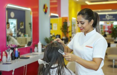 Salon professional working with a client in a trendy Bangalore beauty parlour — ideal for showcasing local job vacancies and staff hiring.