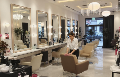 Aspiring salon owner setting up her beauty salon with modern interiors, mirrors, and styling stations